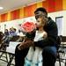 Tyrone Turner and his step-daughter, 9-year-old Amira Reed, watch graduation speeches during the last day of school at Estabrook Elementary on Friday, June 7. They are here to support graduating sixth-grader Desiree Turner. Daniel Brenner I AnnArbor.com